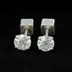 Round cut moissanite stud earrings in 925 sterling silver with screw backs