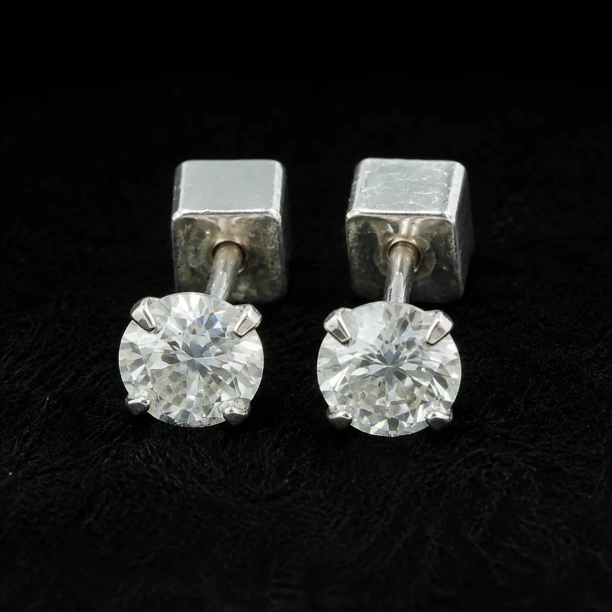 Round cut moissanite stud earrings in 925 sterling silver with screw backs Round cut moissanite stud earrings in 925 sterling silver with screw backs